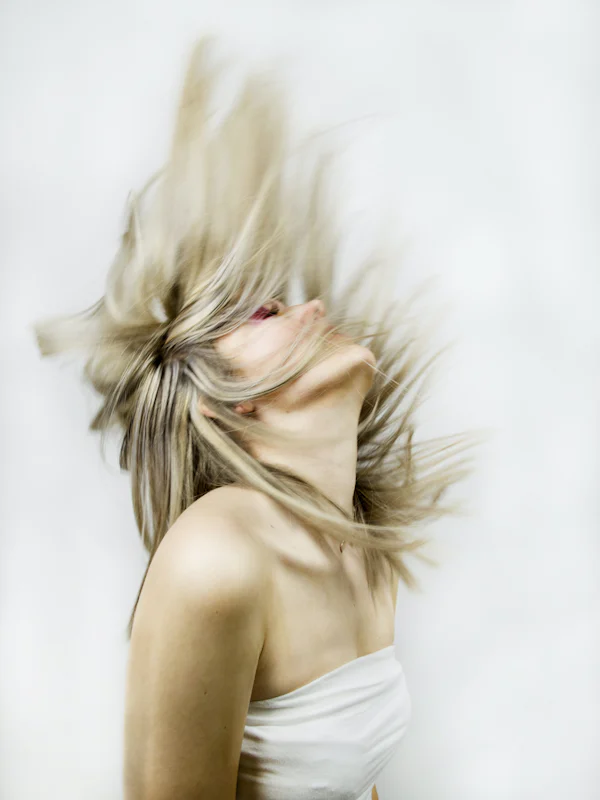 Blonde hair caught in motion